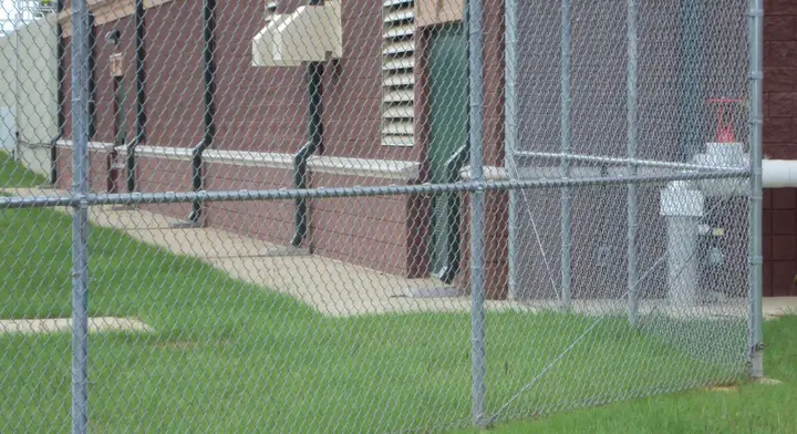 Chain link at a brick building