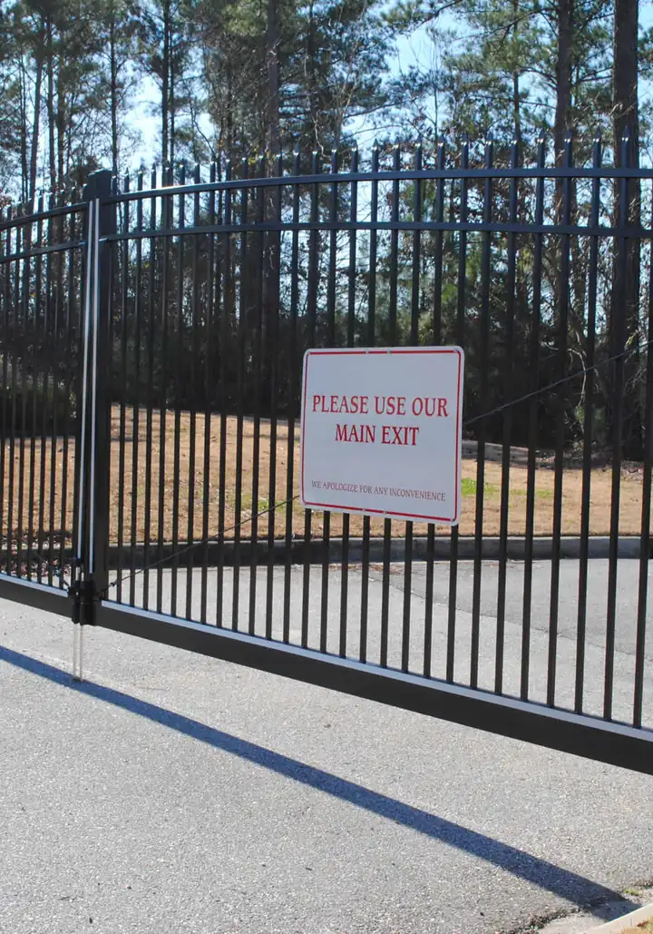Slide gate across a drive