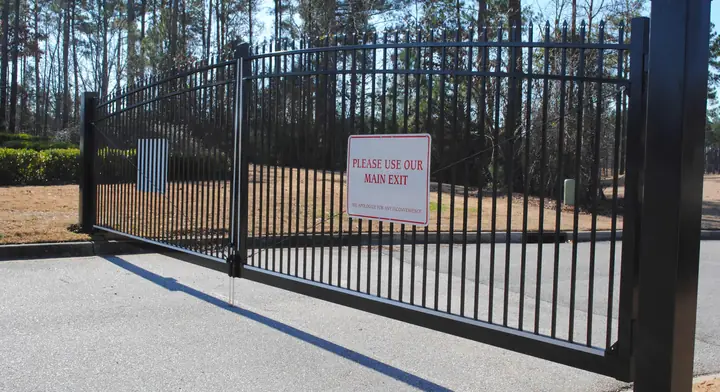 Slide gate across a drive