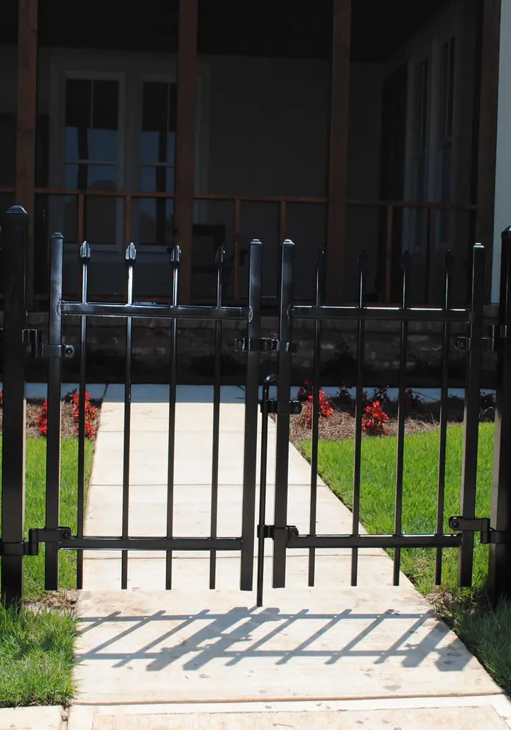 Iron gate between brick columns