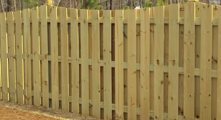 Scalloped picket fencing installed by Allsteel Fence