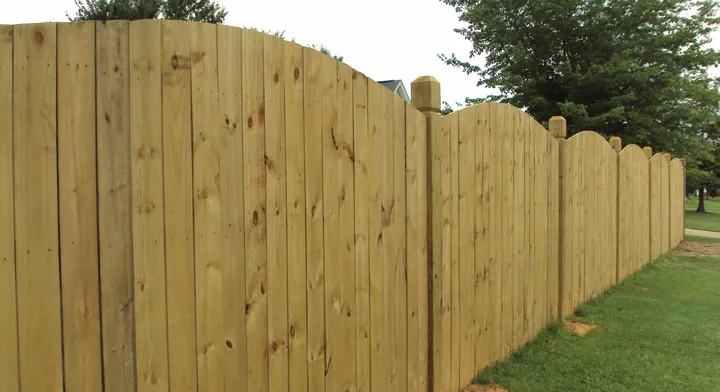 Arched-top privacy fencing installed by Allsteel Fence